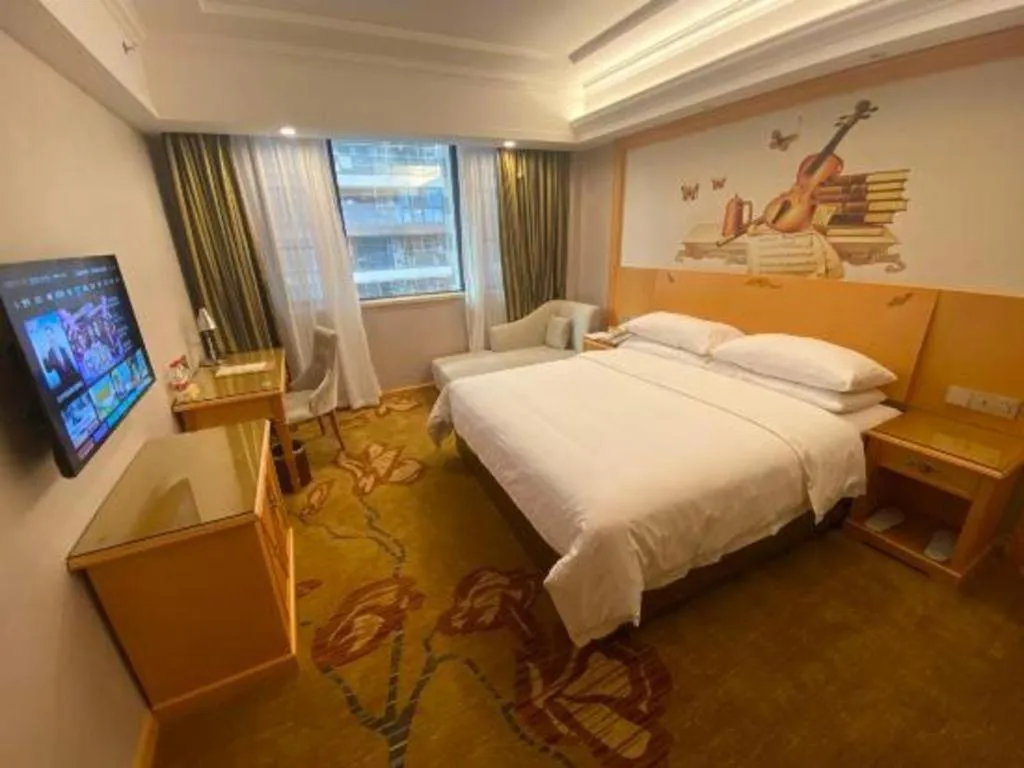 Bed in Vienna Hotel Guangdong Shaoguan Ruyuan Yao Cultural Square