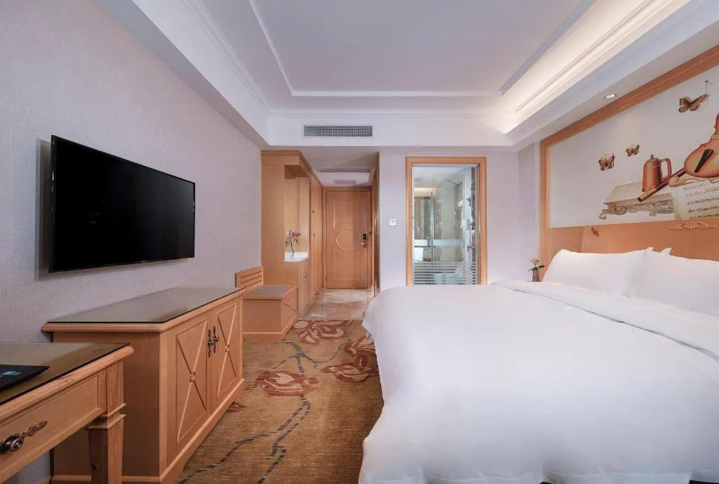 Bed in Vienna Hotel Guangdong Shaoguan Ruyuan Yao Cultural Square