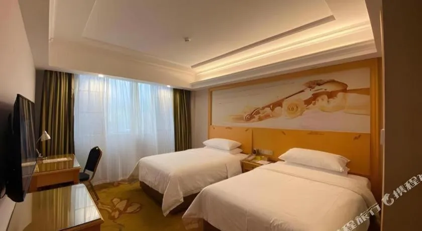 Bed in Vienna Hotel Guangdong Shaoguan Ruyuan Yao Cultural Square