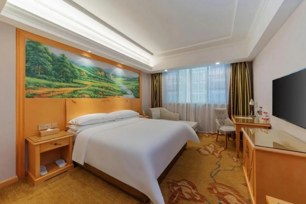 Bed in Vienna Hotel Guangdong Shaoguan Ruyuan Yao Cultural Square