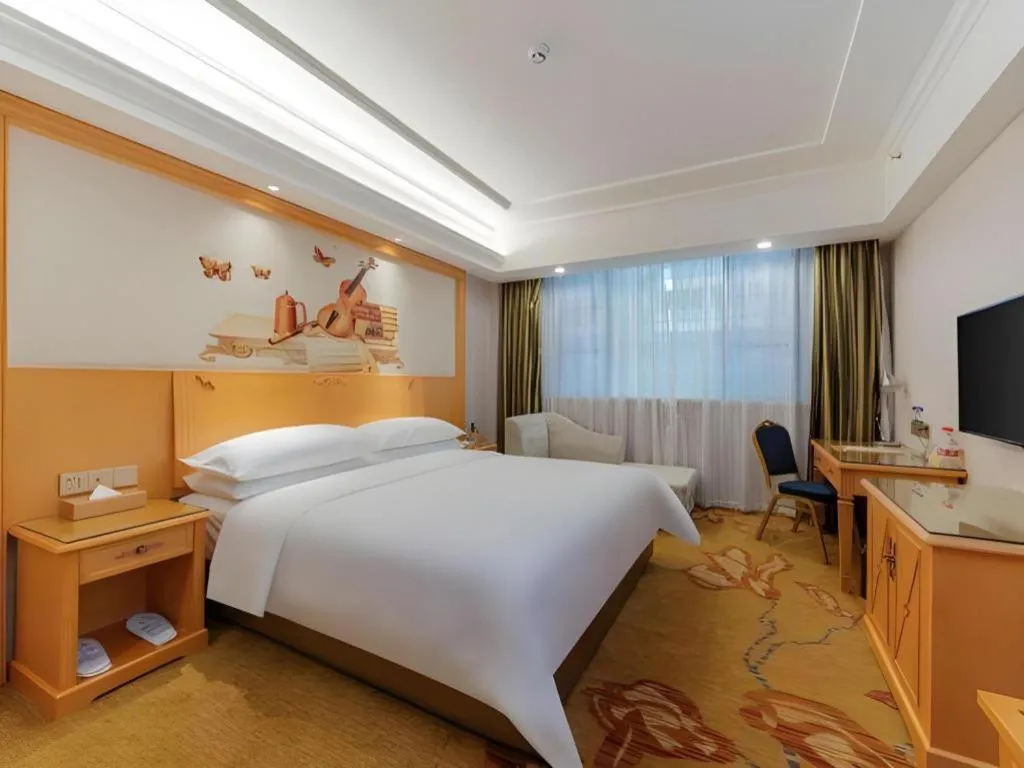 Bed in Vienna Hotel Guangdong Shaoguan Ruyuan Yao Cultural Square