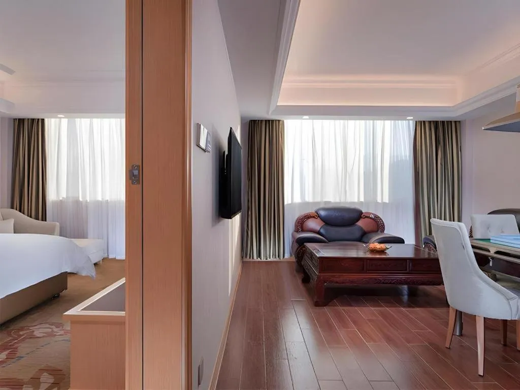 Bed in Vienna Hotel Guangdong Shaoguan Ruyuan Yao Cultural Square