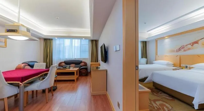 Bed in Vienna Hotel Guangdong Shaoguan Ruyuan Yao Cultural Square