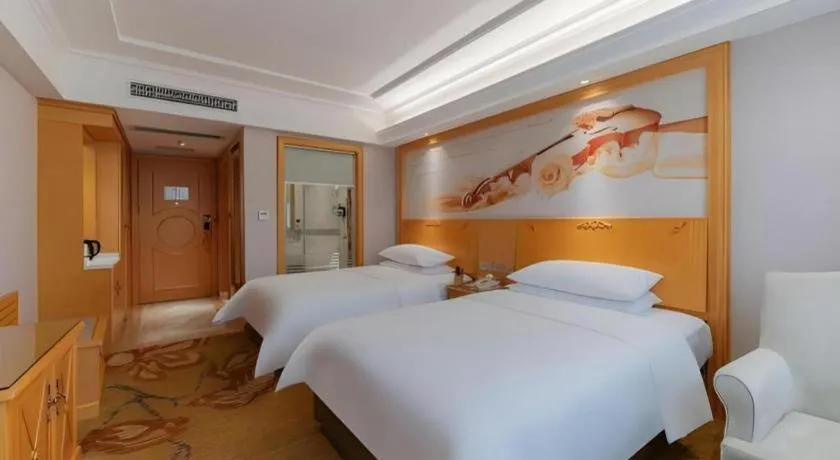 Bed in Vienna Hotel Guangdong Shaoguan Ruyuan Yao Cultural Square