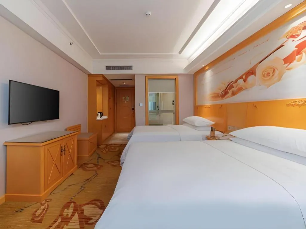 Bed in Vienna Hotel Guangdong Shaoguan Ruyuan Yao Cultural Square