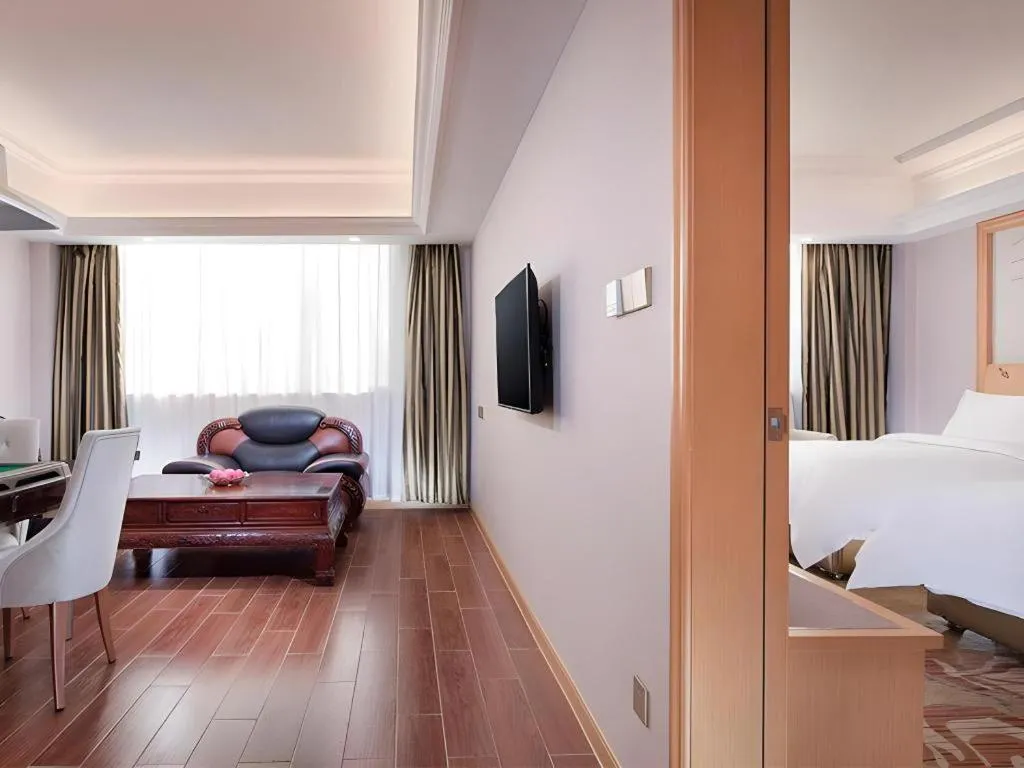 Bed in Vienna Hotel Guangdong Shaoguan Ruyuan Yao Cultural Square