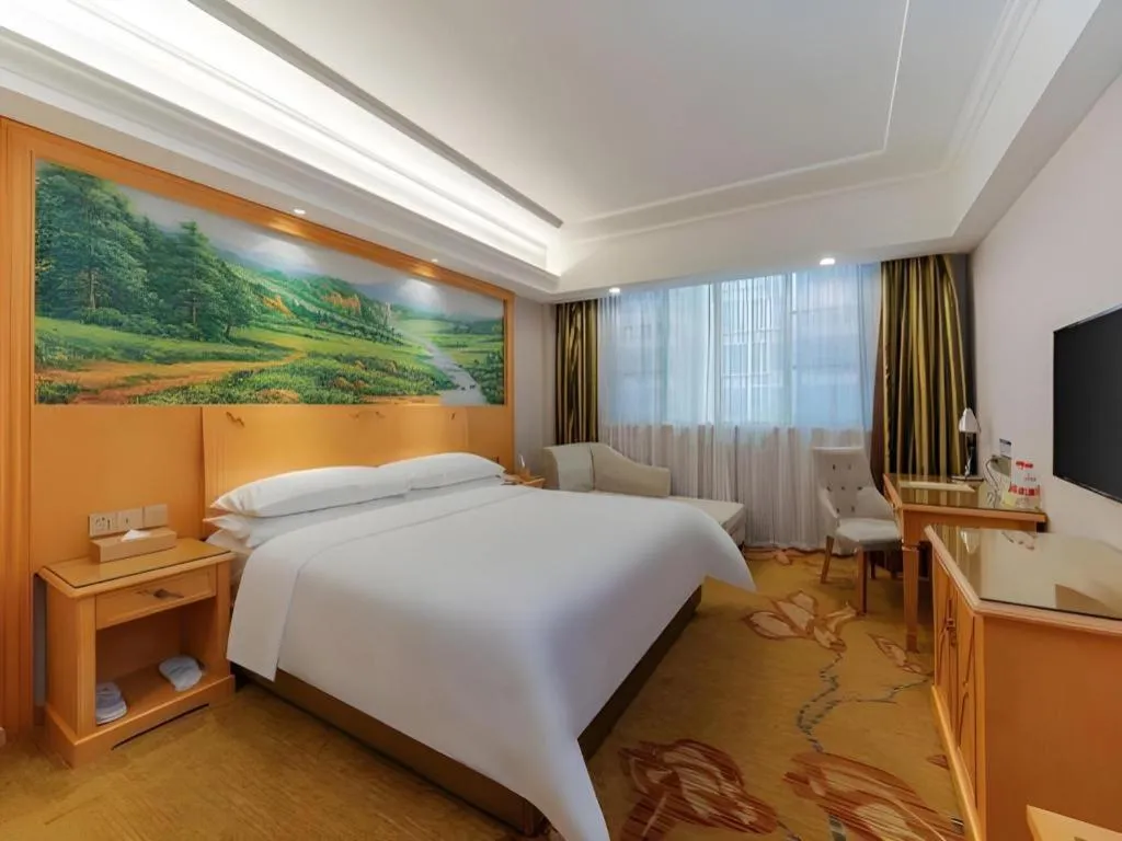 Bed in Vienna Hotel Guangdong Shaoguan Ruyuan Yao Cultural Square