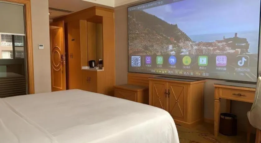 Bed in Vienna Hotel Guangdong Shaoguan Ruyuan Yao Cultural Square