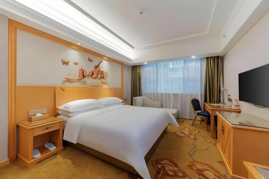 Bed in Vienna Hotel Guangdong Shaoguan Ruyuan Yao Cultural Square