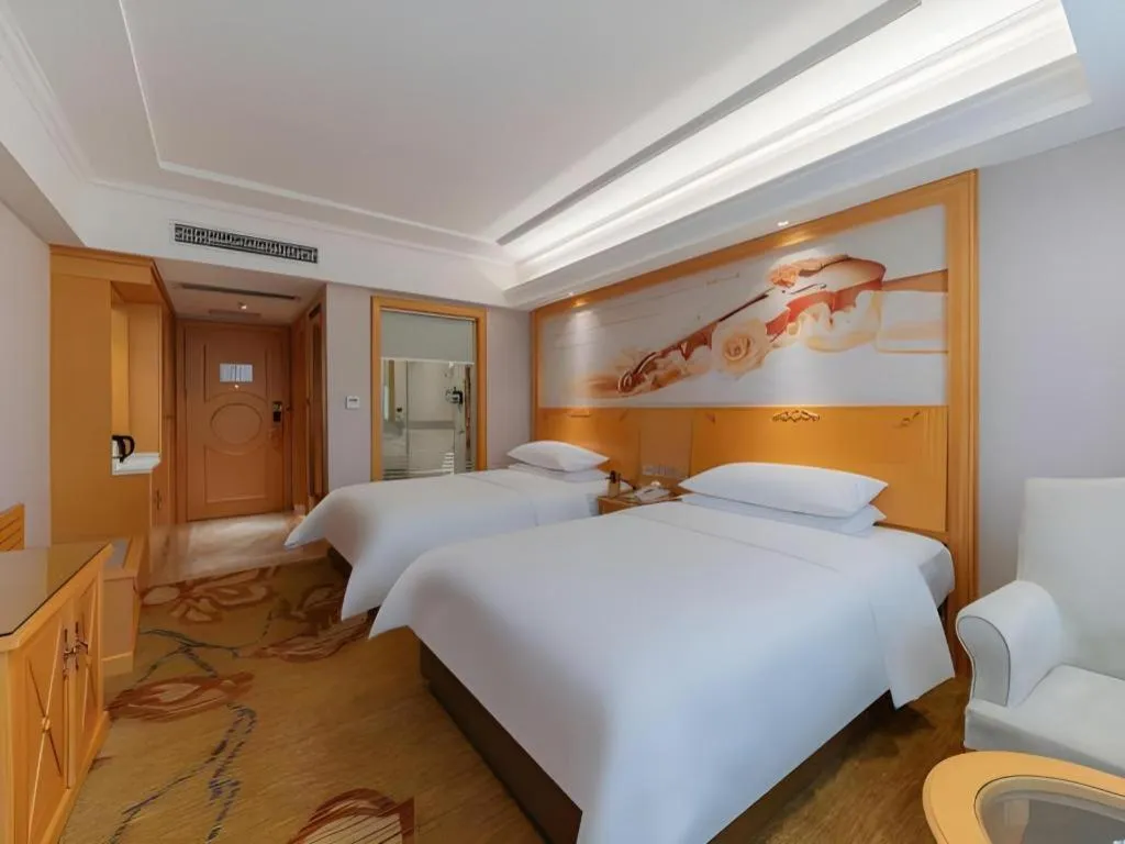 Bed in Vienna Hotel Guangdong Shaoguan Ruyuan Yao Cultural Square