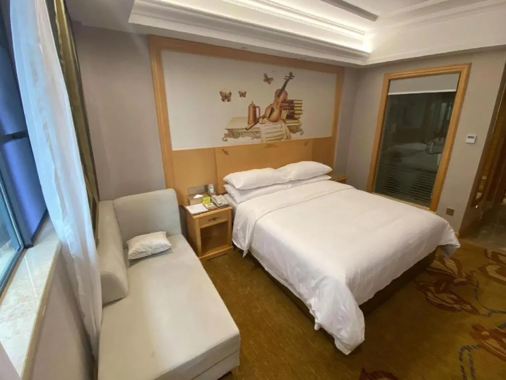 Bed in Vienna Hotel Guangdong Shaoguan Ruyuan Yao Cultural Square
