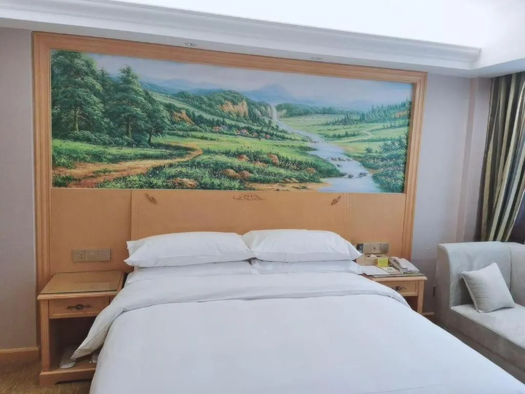 Bed in Vienna Hotel Guangdong Shaoguan Ruyuan Yao Cultural Square