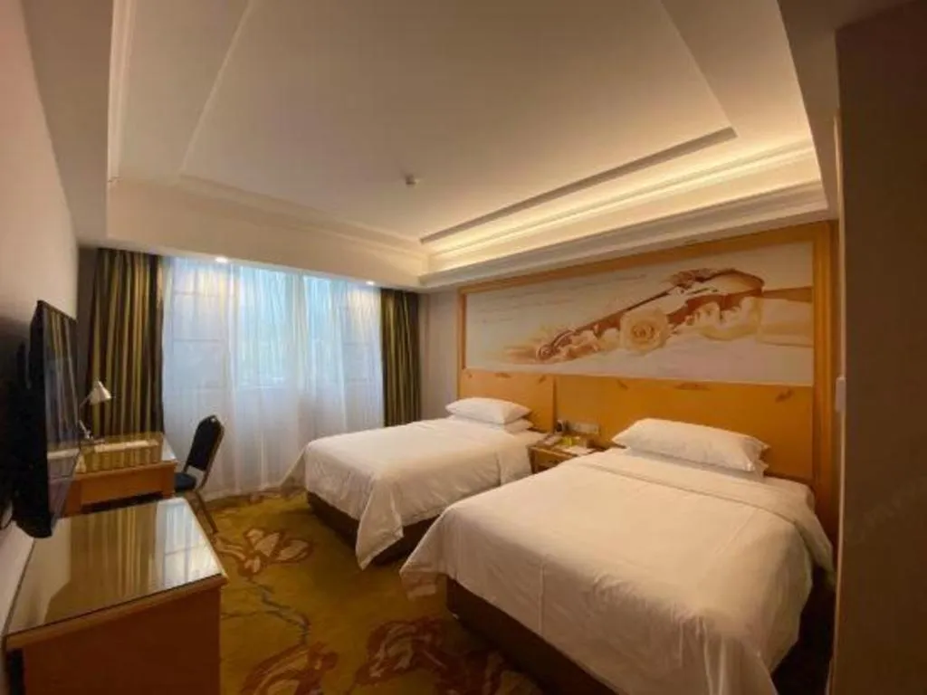 Bed in Vienna Hotel Guangdong Shaoguan Ruyuan Yao Cultural Square