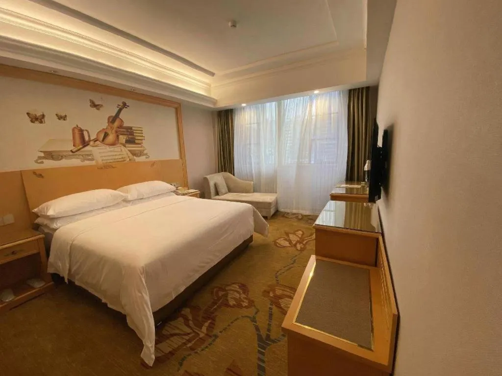 Bed in Vienna Hotel Guangdong Shaoguan Ruyuan Yao Cultural Square