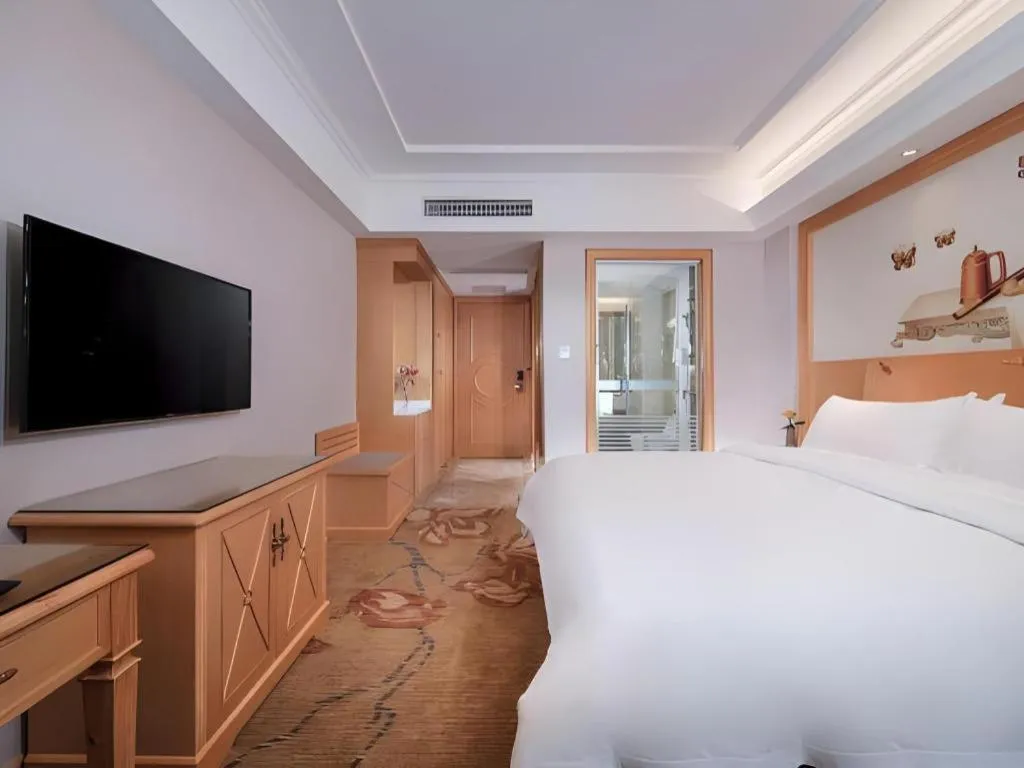 Bed in Vienna Hotel Guangdong Shaoguan Ruyuan Yao Cultural Square