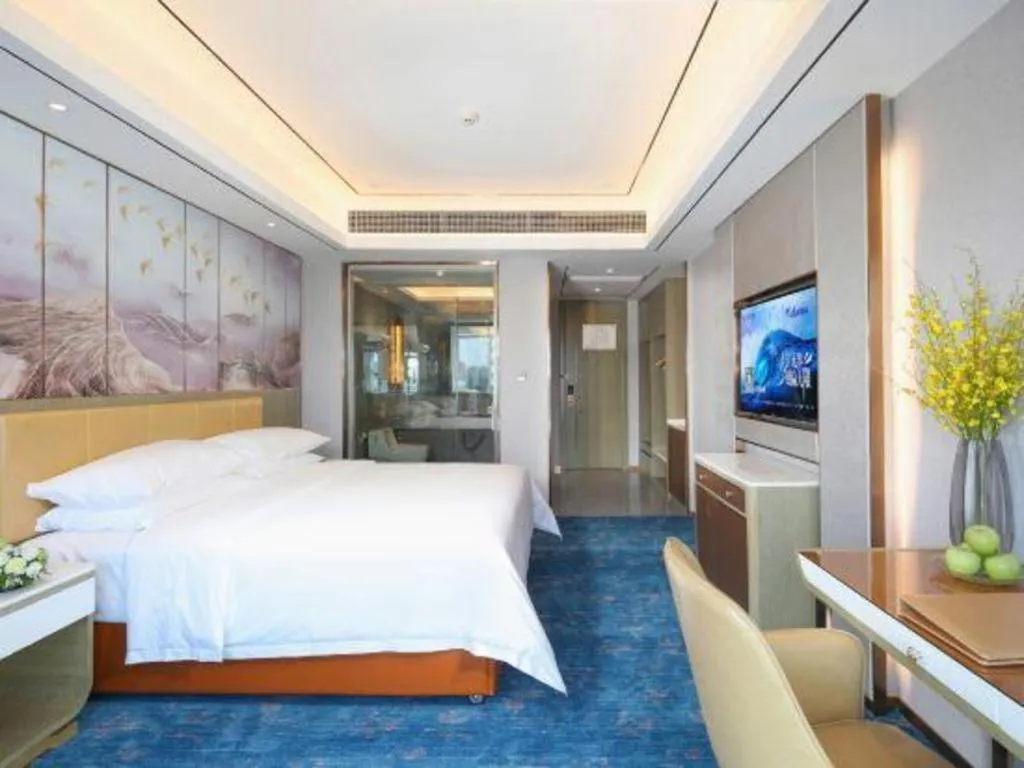 Bed in Venus Royal Hotel Guangxi Wuzhou Sanqicheng Meiguihu Park