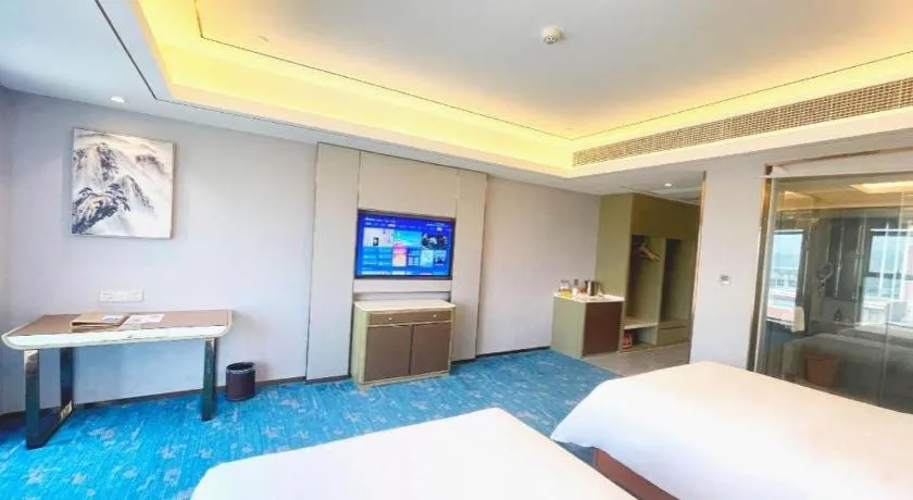 Bed in Venus Royal Hotel Guangxi Wuzhou Sanqicheng Meiguihu Park