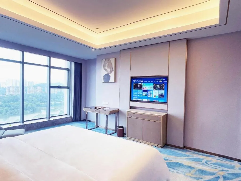 Bed in Venus Royal Hotel Guangxi Wuzhou Sanqicheng Meiguihu Park