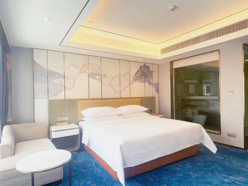 Bed in Venus Royal Hotel Guangxi Wuzhou Sanqicheng Meiguihu Park