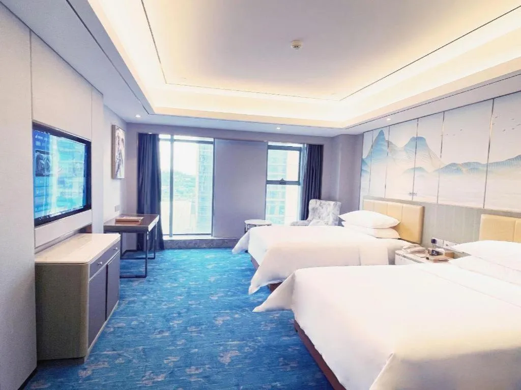 Bed in Venus Royal Hotel Guangxi Wuzhou Sanqicheng Meiguihu Park