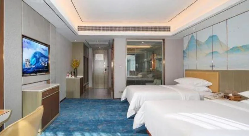 Bed in Venus Royal Hotel Guangxi Wuzhou Sanqicheng Meiguihu Park