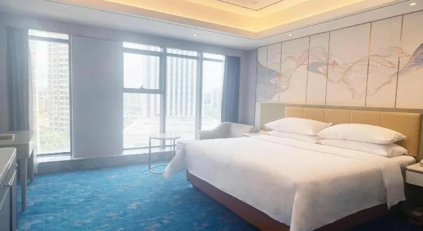 Bed in Venus Royal Hotel Guangxi Wuzhou Sanqicheng Meiguihu Park