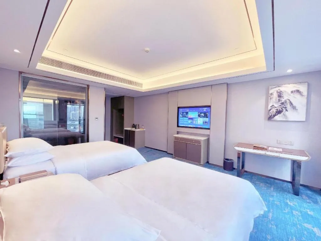 Bed in Venus Royal Hotel Guangxi Wuzhou Sanqicheng Meiguihu Park