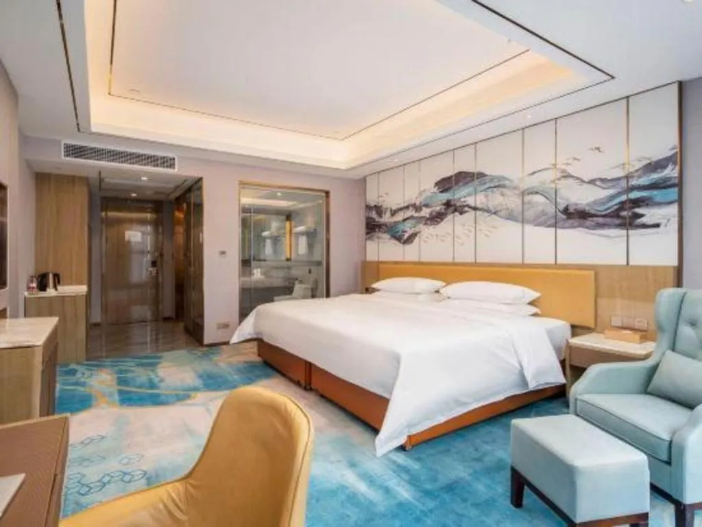 Bed in Venus Royal Hotel Guangxi Wuzhou Sanqicheng Meiguihu Park