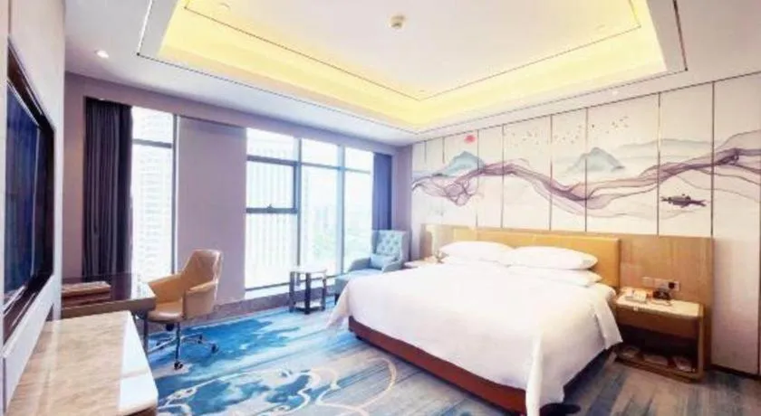 Bed in Venus Royal Hotel Guangxi Wuzhou Sanqicheng Meiguihu Park