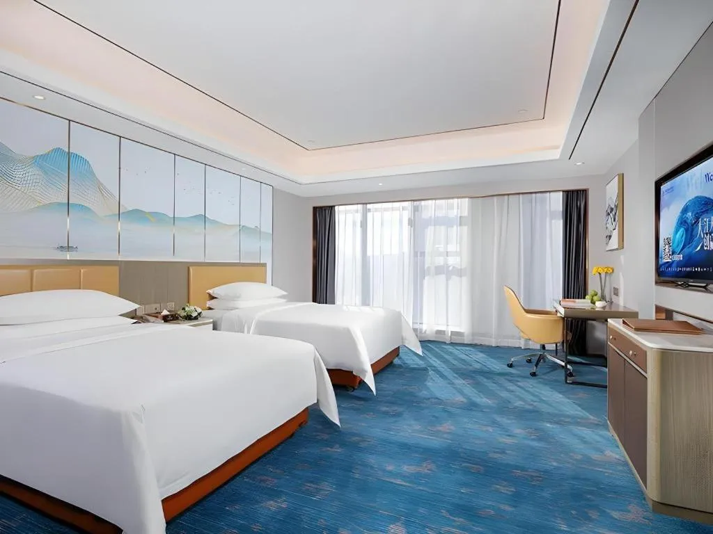 Bed in Venus Royal Hotel Guangxi Wuzhou Sanqicheng Meiguihu Park