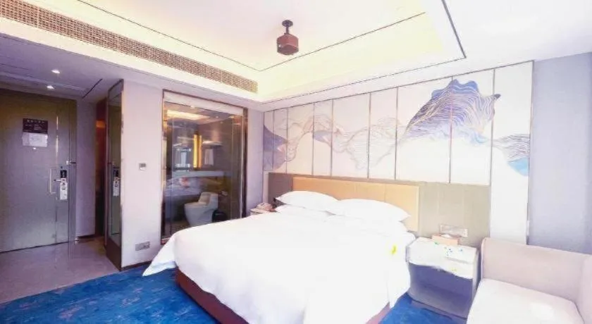 Bed in Venus Royal Hotel Guangxi Wuzhou Sanqicheng Meiguihu Park