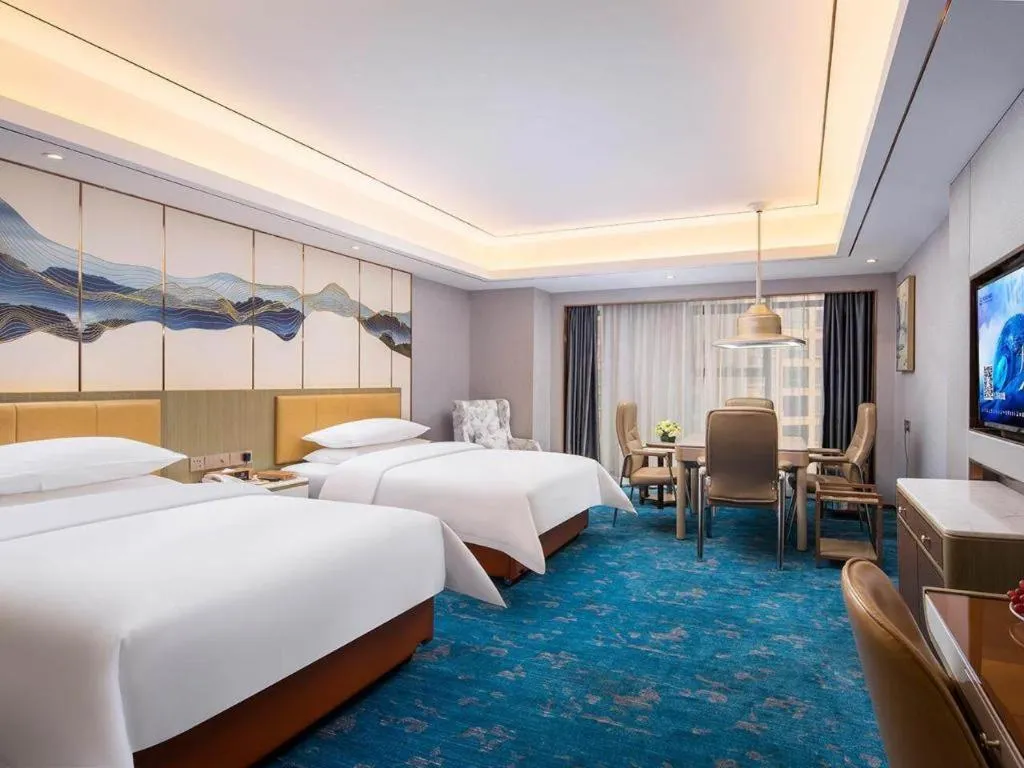 Bed in Venus Royal Hotel Guangxi Wuzhou Sanqicheng Meiguihu Park