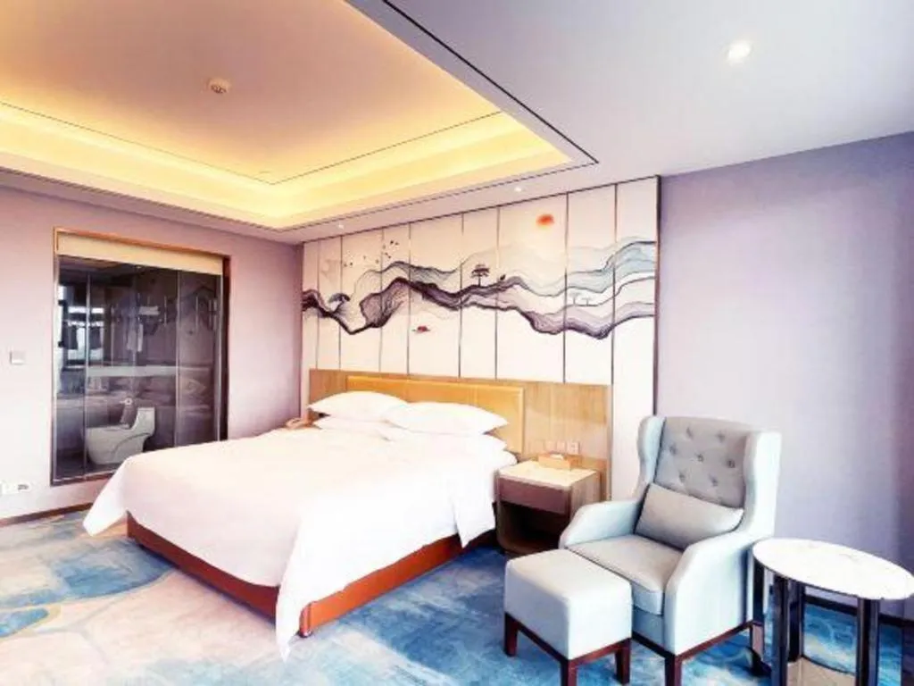 Bed in Venus Royal Hotel Guangxi Wuzhou Sanqicheng Meiguihu Park