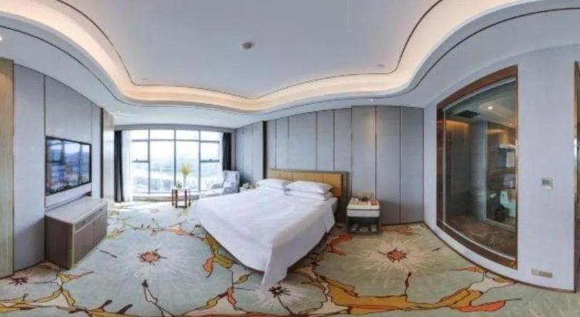 Bed in Venus Royal Hotel Guangxi Wuzhou Sanqicheng Meiguihu Park