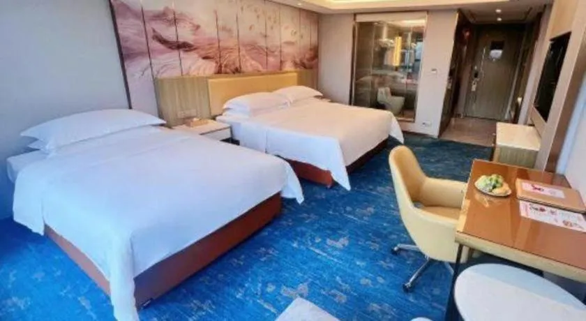 Bed in Venus Royal Hotel Guangxi Wuzhou Sanqicheng Meiguihu Park