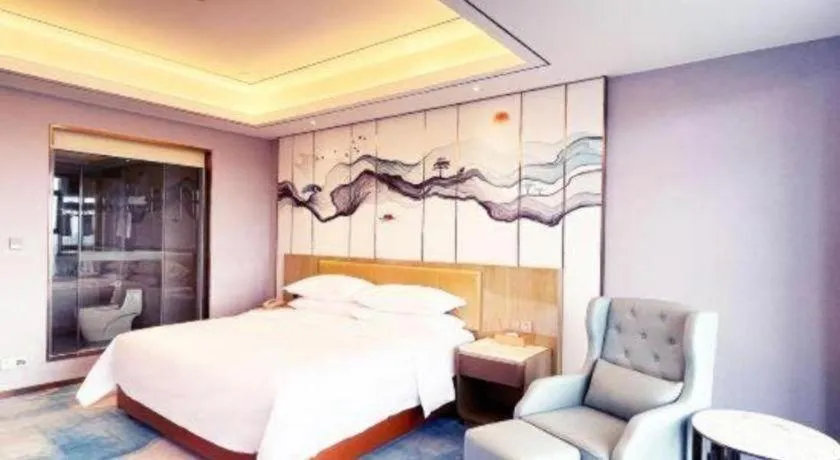 Bed in Venus Royal Hotel Guangxi Wuzhou Sanqicheng Meiguihu Park