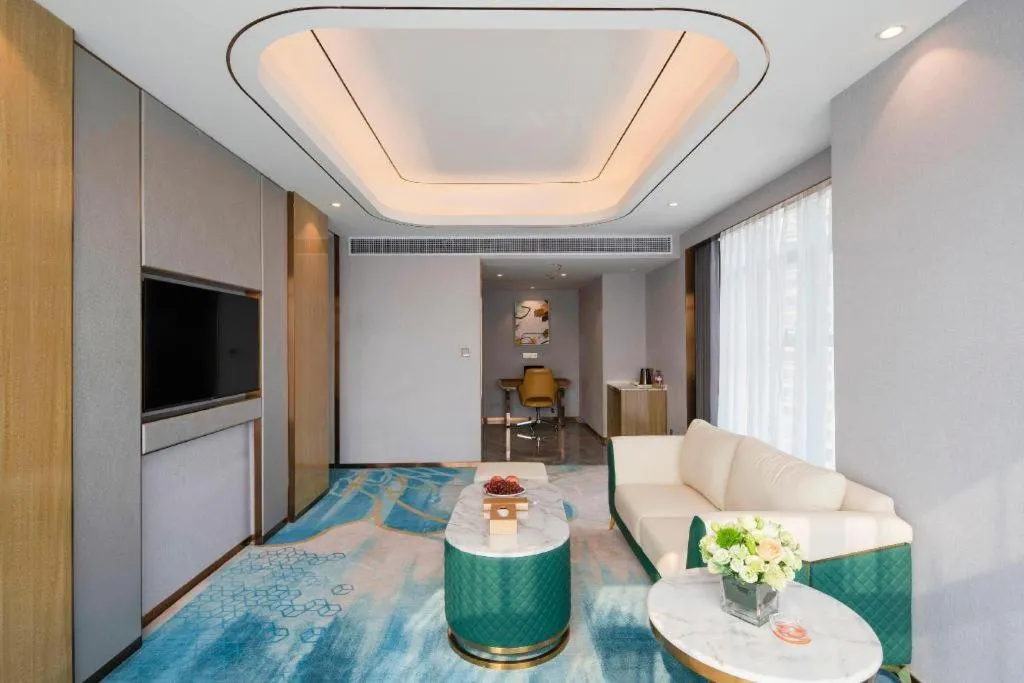 Bed in Venus Royal Hotel Guangxi Wuzhou Sanqicheng Meiguihu Park