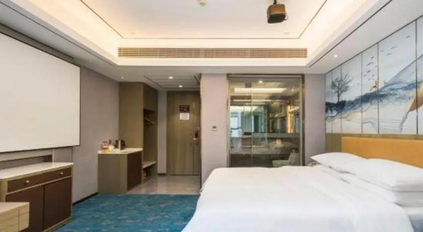 Bed in Venus Royal Hotel Guangxi Wuzhou Sanqicheng Meiguihu Park