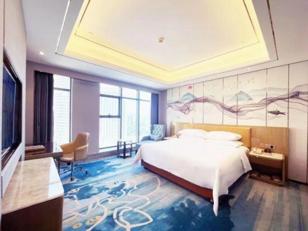 Bed in Venus Royal Hotel Guangxi Wuzhou Sanqicheng Meiguihu Park