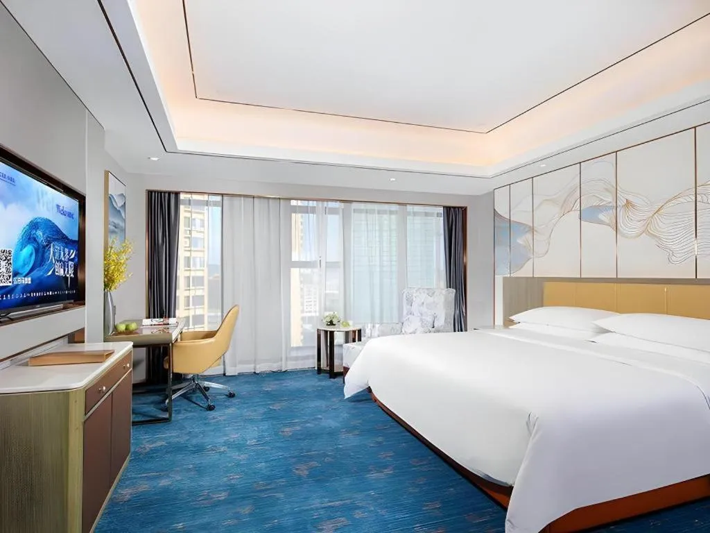 Bed in Venus Royal Hotel Guangxi Wuzhou Sanqicheng Meiguihu Park