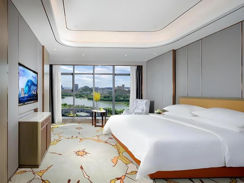 Bed in Venus Royal Hotel Guangxi Wuzhou Sanqicheng Meiguihu Park