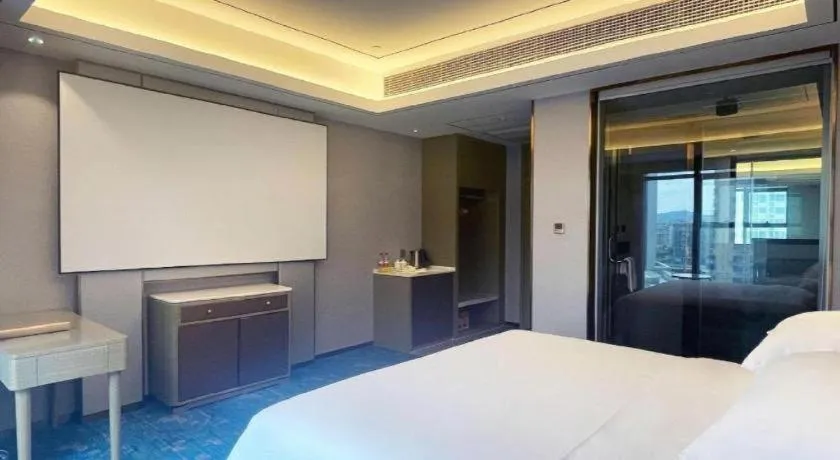 Bed in Venus Royal Hotel Guangxi Wuzhou Sanqicheng Meiguihu Park