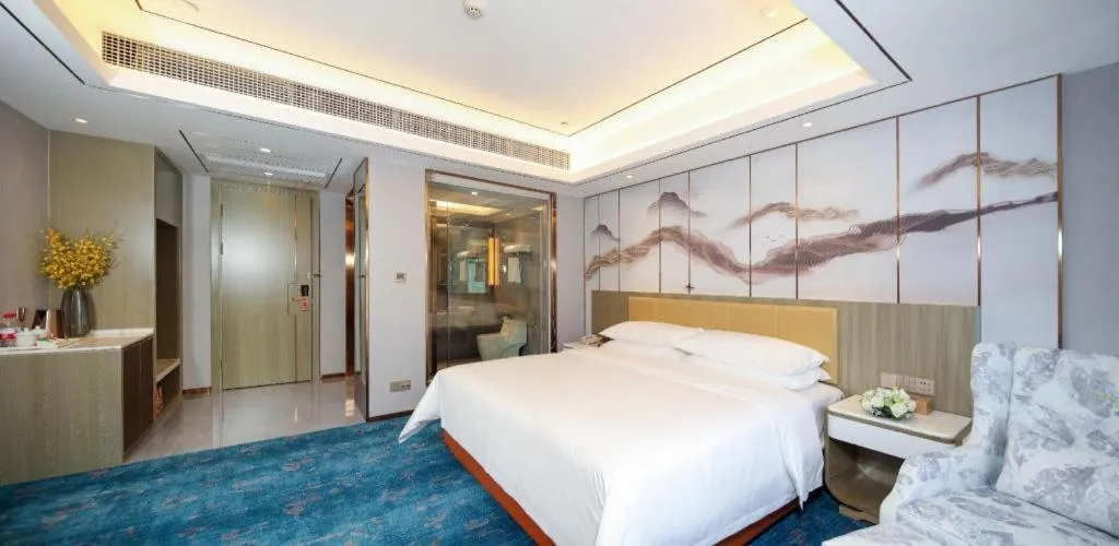 Bed in Venus Royal Hotel Guangxi Wuzhou Sanqicheng Meiguihu Park