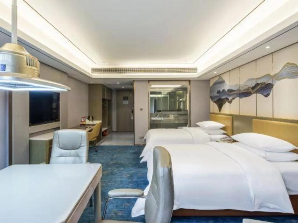 Bed in Venus Royal Hotel Guangxi Wuzhou Sanqicheng Meiguihu Park