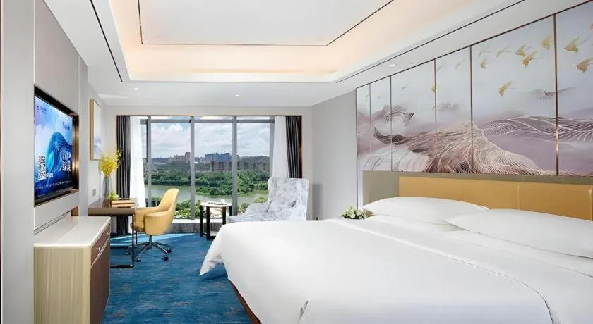 Bed in Venus Royal Hotel Guangxi Wuzhou Sanqicheng Meiguihu Park