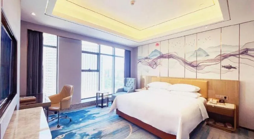 Bed in Venus Royal Hotel Guangxi Wuzhou Sanqicheng Meiguihu Park