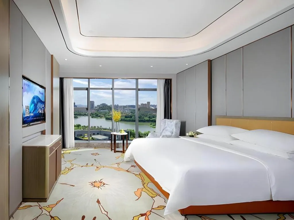 Bed in Venus Royal Hotel Guangxi Wuzhou Sanqicheng Meiguihu Park