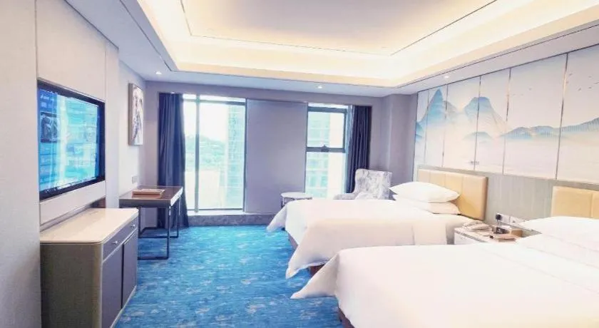 Bed in Venus Royal Hotel Guangxi Wuzhou Sanqicheng Meiguihu Park