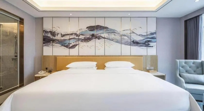 Bed in Venus Royal Hotel Guangxi Wuzhou Sanqicheng Meiguihu Park