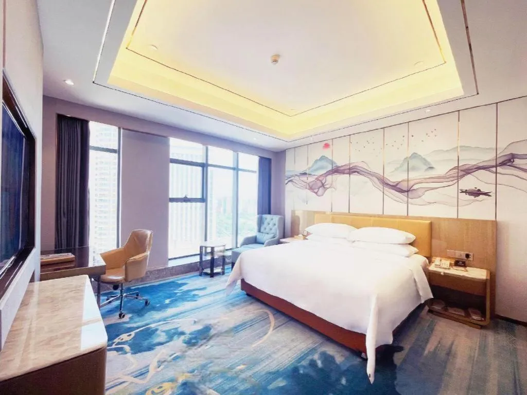 Bed in Venus Royal Hotel Guangxi Wuzhou Sanqicheng Meiguihu Park